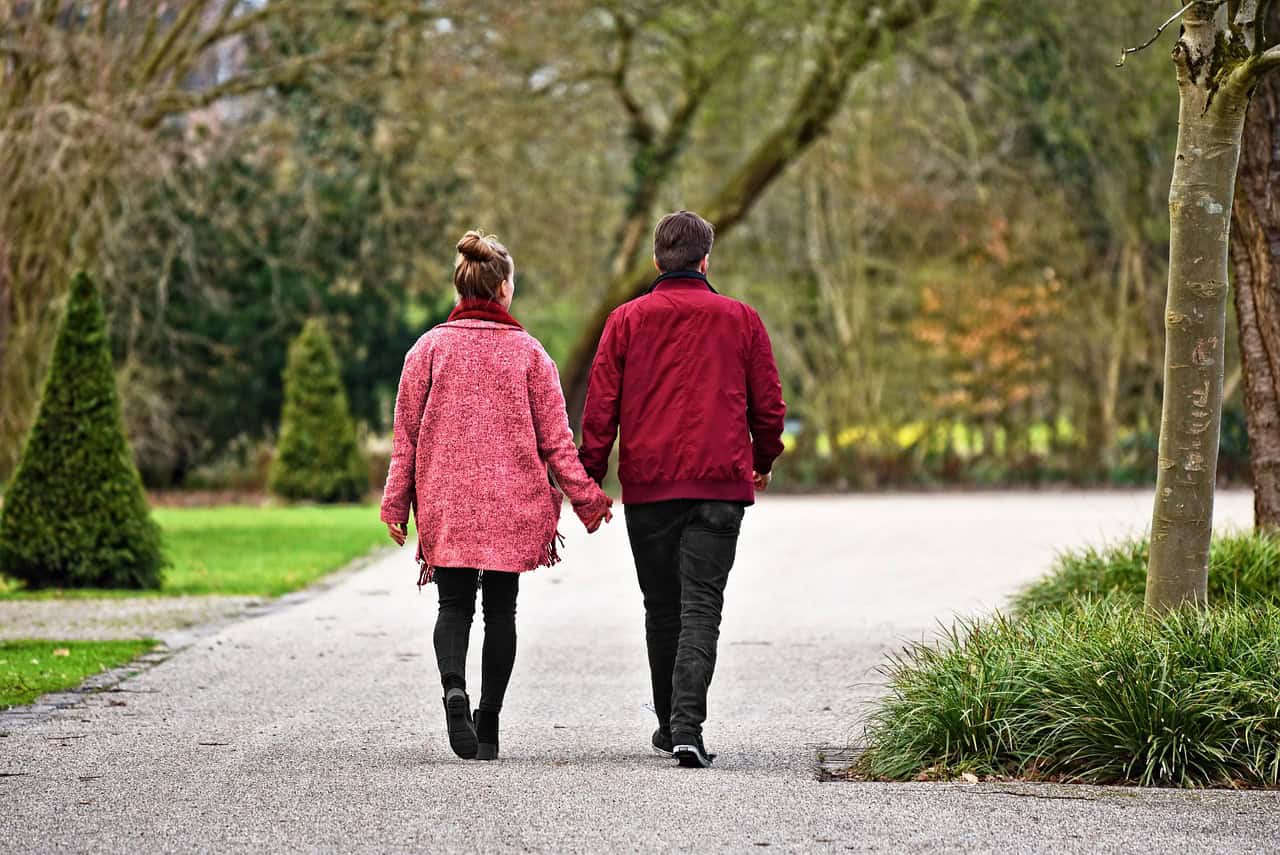 Older couple walking together in a Florida park
